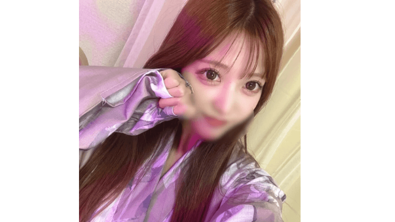 Stripchat ASUKA, a beautiful 24yo Japanese cam girl with big eyes, looking at the camera in a cute cosplay outfit.