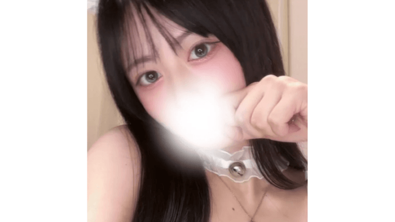 Stripchat Rira_nya, a beautiful 20yo Japanese student model, looking into the camera with her large expressive eyes and an innocent expression.
