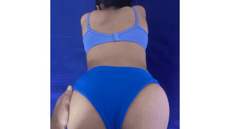 Stripchat escape_with_me posing on all fours, showcasing her massive ass and voluptuous Indian curves to the camera in a seductive pose.